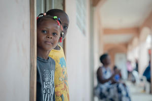 children in haiti standing near wall