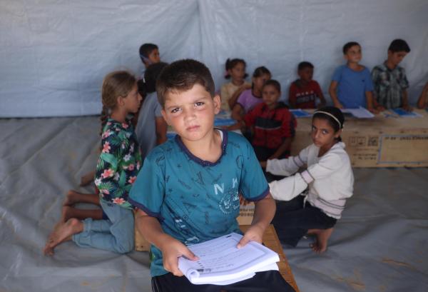 boy holding notebook