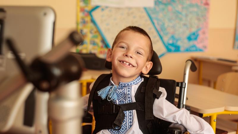Boy in wheelchair smiling