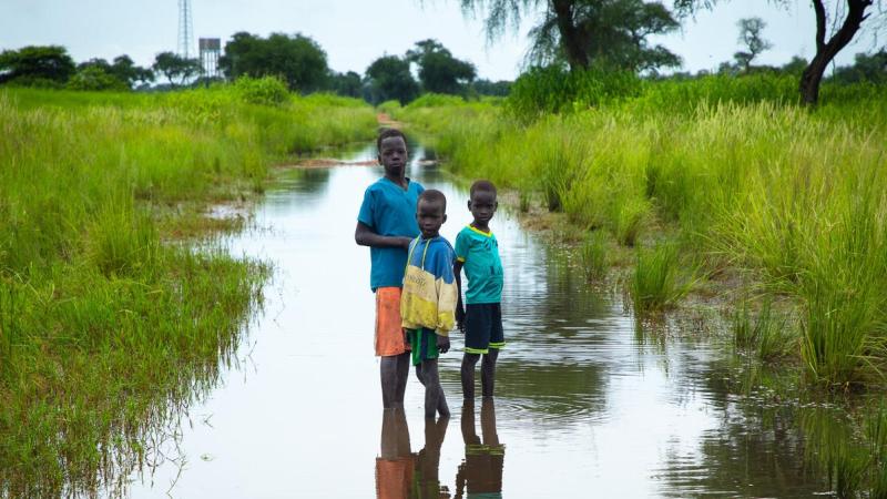 boys standing in floodwater in Ethiopia